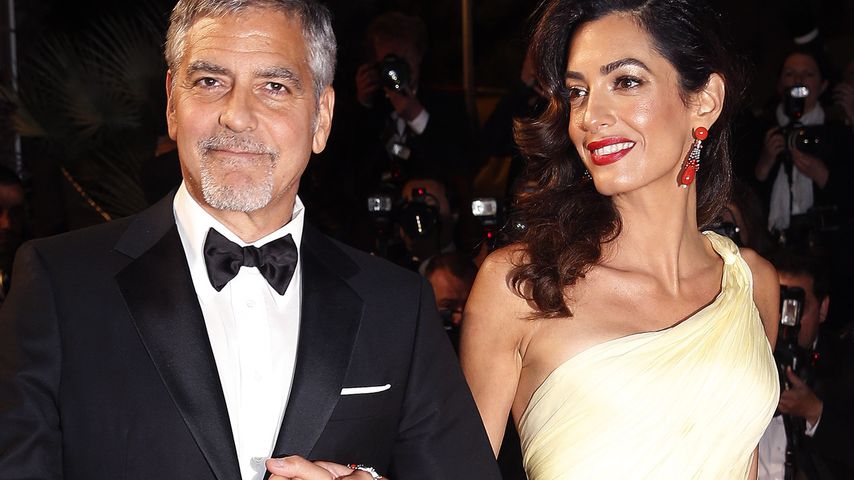 George Clooney und seine Frau Amal auf dem roten Teppich in Cannes 2016